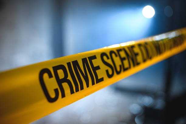 Crime scene barricade covering. Murder case of a criminal young male.